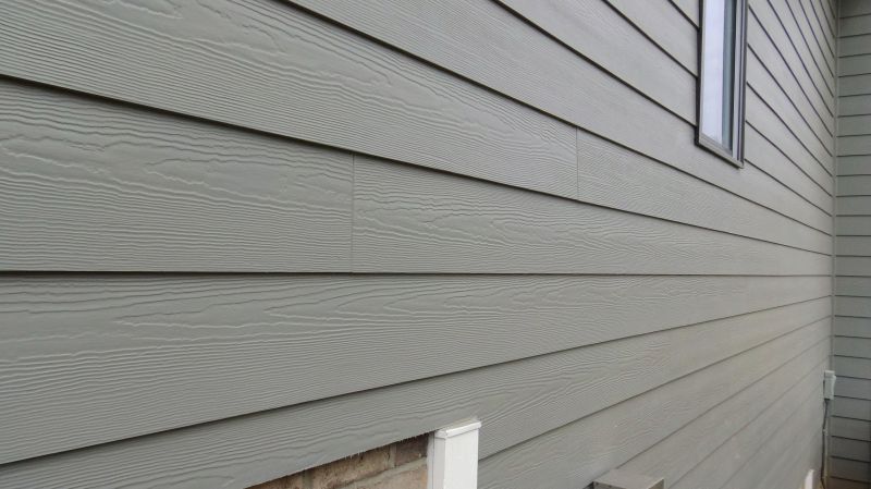 Fiber cement siding being applied
